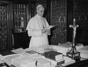 Pius XII at his desk.