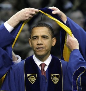 President Barack Obama is hooded as he receives an Honorary Doctorate Degree in Laws during commencement ceremonies at the University of Notre Dame in South Bend, Ind., campus Sunday, May 17, 2009. (AP Photo/Charles Rex Arbogast)
