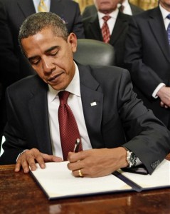 www.thecatholicthing.org_images_obama-sign
