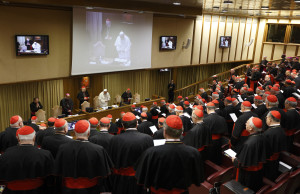 Pope Francis leads opening prayer during a meeting of cardinals in the synod hall at the Vatican Feb. 20. The pope asked the world's cardinals and those about to be made cardinals to meet at the Vatican Feb. 20-21 to discuss the church's pastoral approach to the family. (CNS photo/Paul Haring) (Feb. 20, 2014) See POPE-FAMILY Feb. 20, 2014.