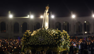 A statue of Our Lady of Fatima is carried during a candlelight vigil attended by Pope Benedict XVI at the Marian shrine of Fatima in central Portugal May 12. (CNS photo/Hugo Correia, Reuters) (May 13, 2010) See FATIMA-ARRIVE May 12, 2010.