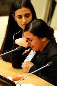 Samia Sleman, 15, a Yazidi who was held hostage and raped by members of the Islamic State when she was 13, cries while speaking at a conference addressing the persecution of Christians and other minorities in the Middle East and Africa at the United Nations April 28. Also pictured is human-rights advocate Jacqueline Isaac. The Vatican mission to the U.N. was a co-sponsor of the conference. (CNS photo/Gregory A. Shemitz) See UN-CHRISTIANS-MIDDLE-EAST April 29, 2016.